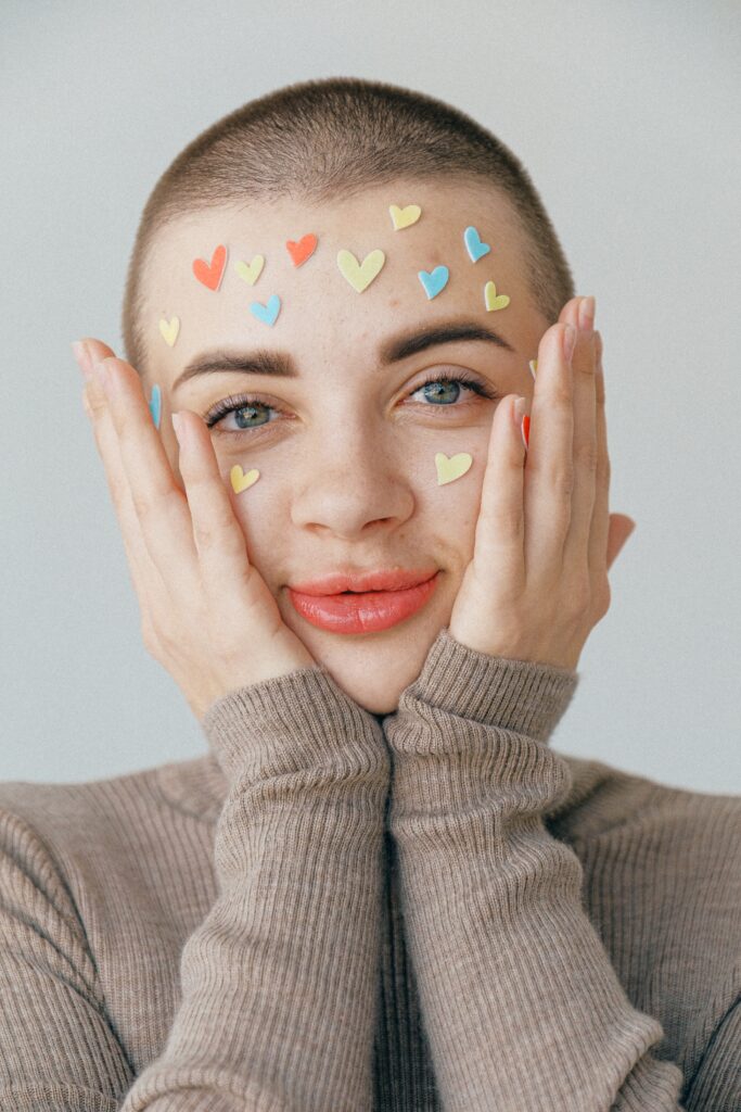 Woman with her face covered in tiny hearts