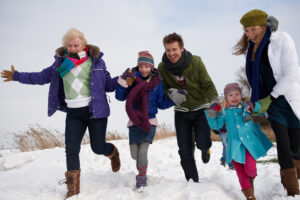 Happy multi-generational family in the snow